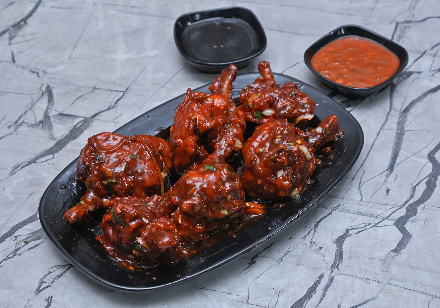 Schezwan chicken lollipops